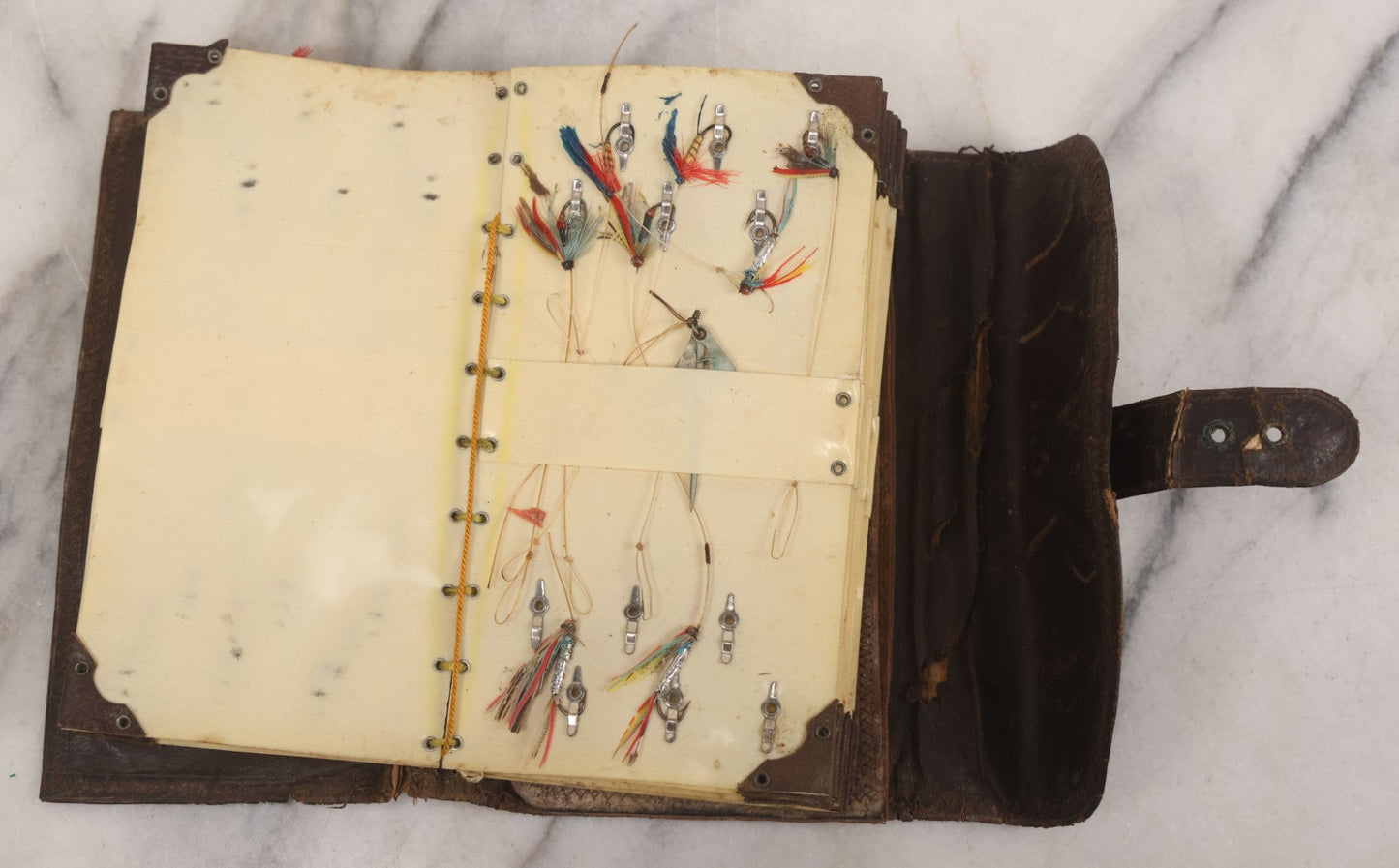Lot 050 - Antique Leather Fly Fisherman's Wallet Book With Celluloid Pages, Many Fly Fishing Lures, Some Marked "Playfair's, Made In Scotland," Note Flies Have Varying Degrees Of Ware, Losses, As Found
