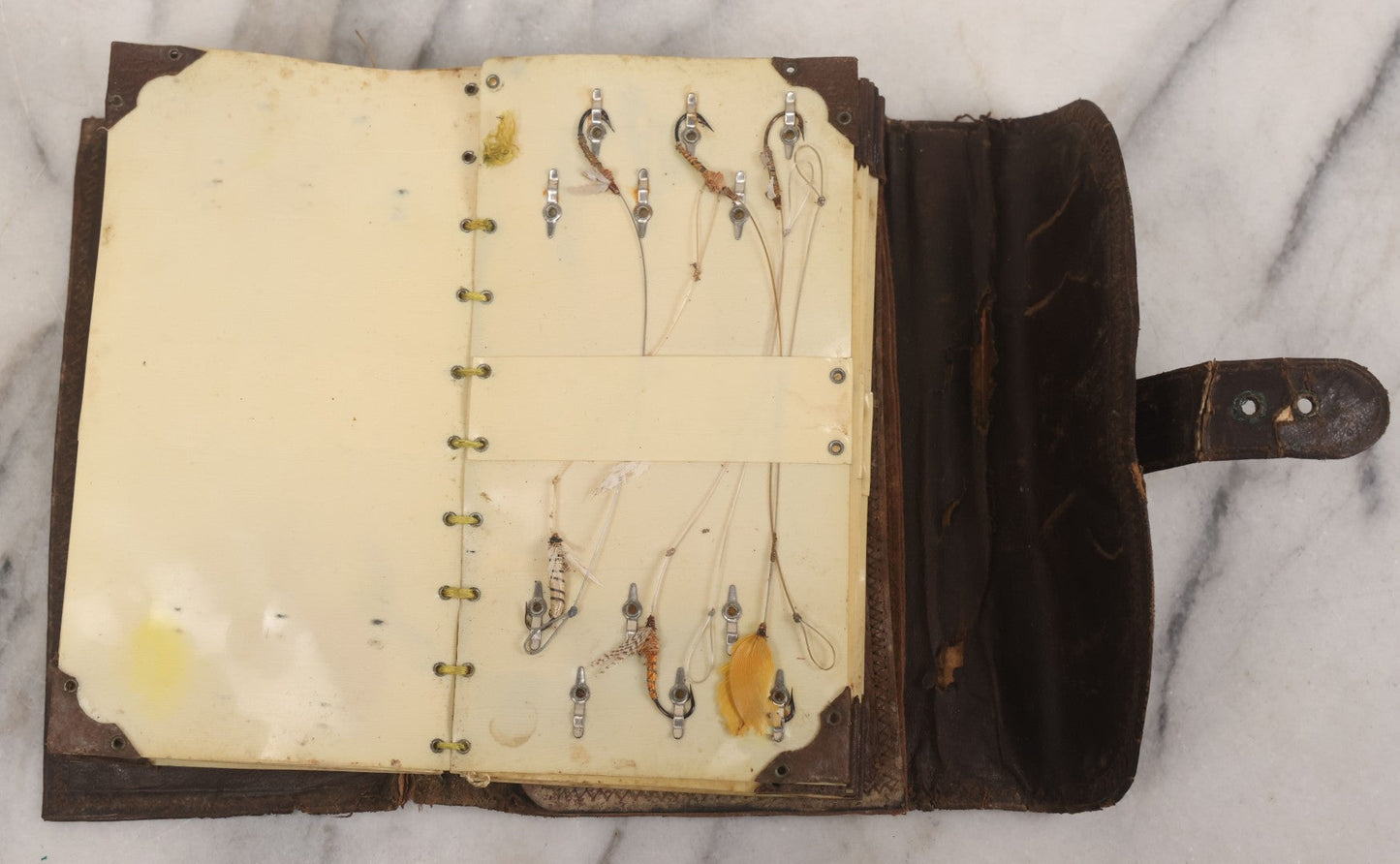 Lot 050 - Antique Leather Fly Fisherman's Wallet Book With Celluloid Pages, Many Fly Fishing Lures, Some Marked "Playfair's, Made In Scotland," Note Flies Have Varying Degrees Of Ware, Losses, As Found
