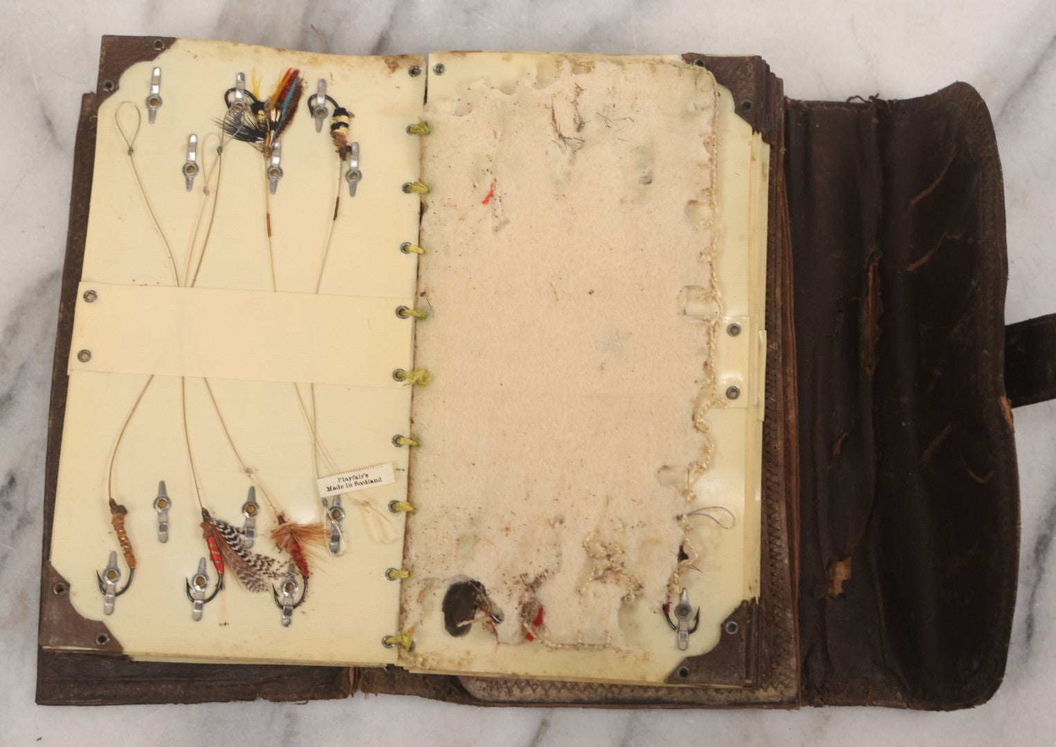 Lot 050 - Antique Leather Fly Fisherman's Wallet Book With Celluloid Pages, Many Fly Fishing Lures, Some Marked "Playfair's, Made In Scotland," Note Flies Have Varying Degrees Of Ware, Losses, As Found