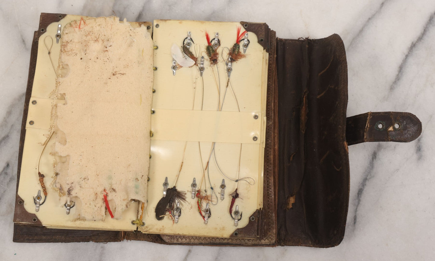 Lot 050 - Antique Leather Fly Fisherman's Wallet Book With Celluloid Pages, Many Fly Fishing Lures, Some Marked "Playfair's, Made In Scotland," Note Flies Have Varying Degrees Of Ware, Losses, As Found