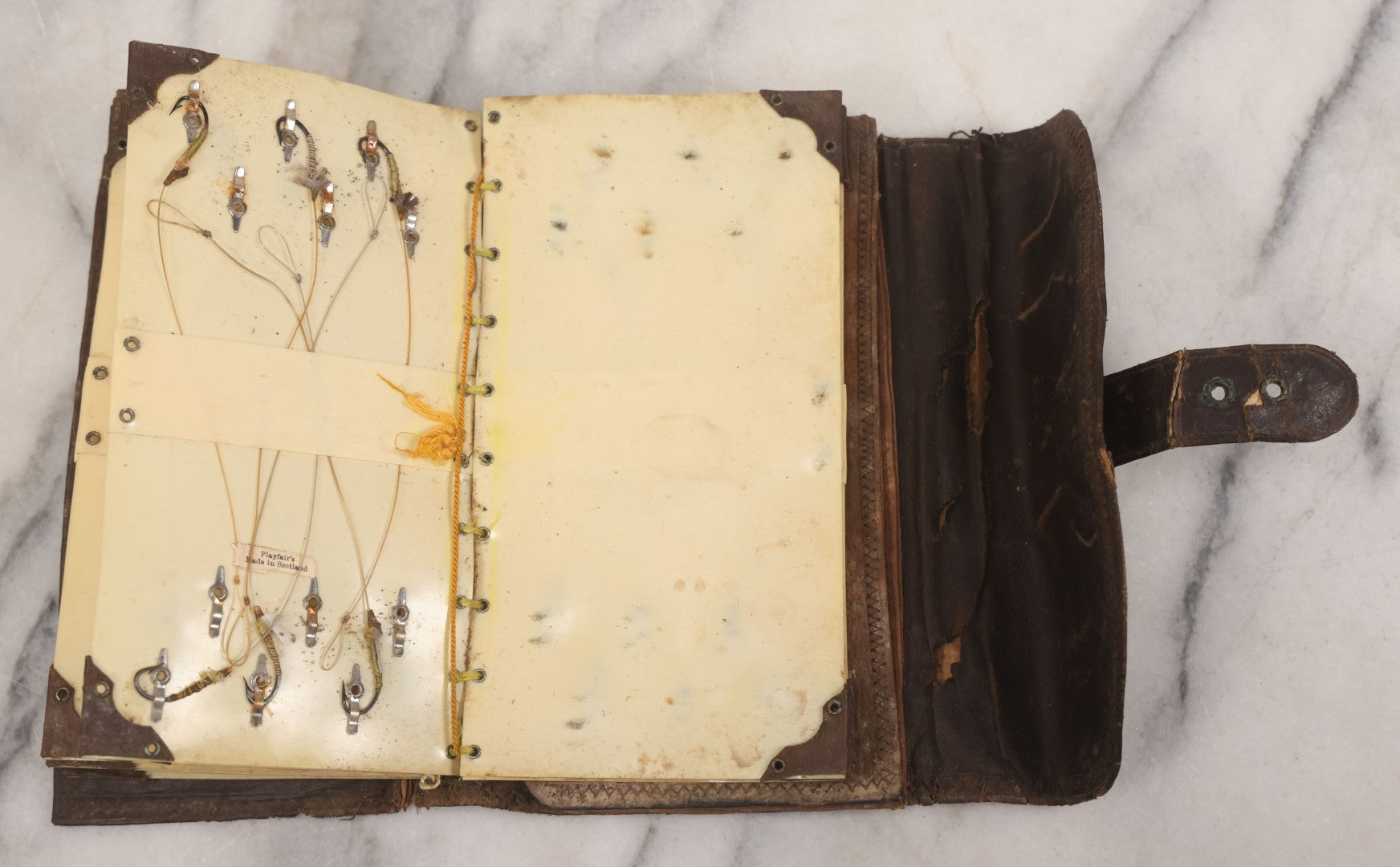 Lot 050 - Antique Leather Fly Fisherman's Wallet Book With Celluloid Pages, Many Fly Fishing Lures, Some Marked "Playfair's, Made In Scotland," Note Flies Have Varying Degrees Of Ware, Losses, As Found