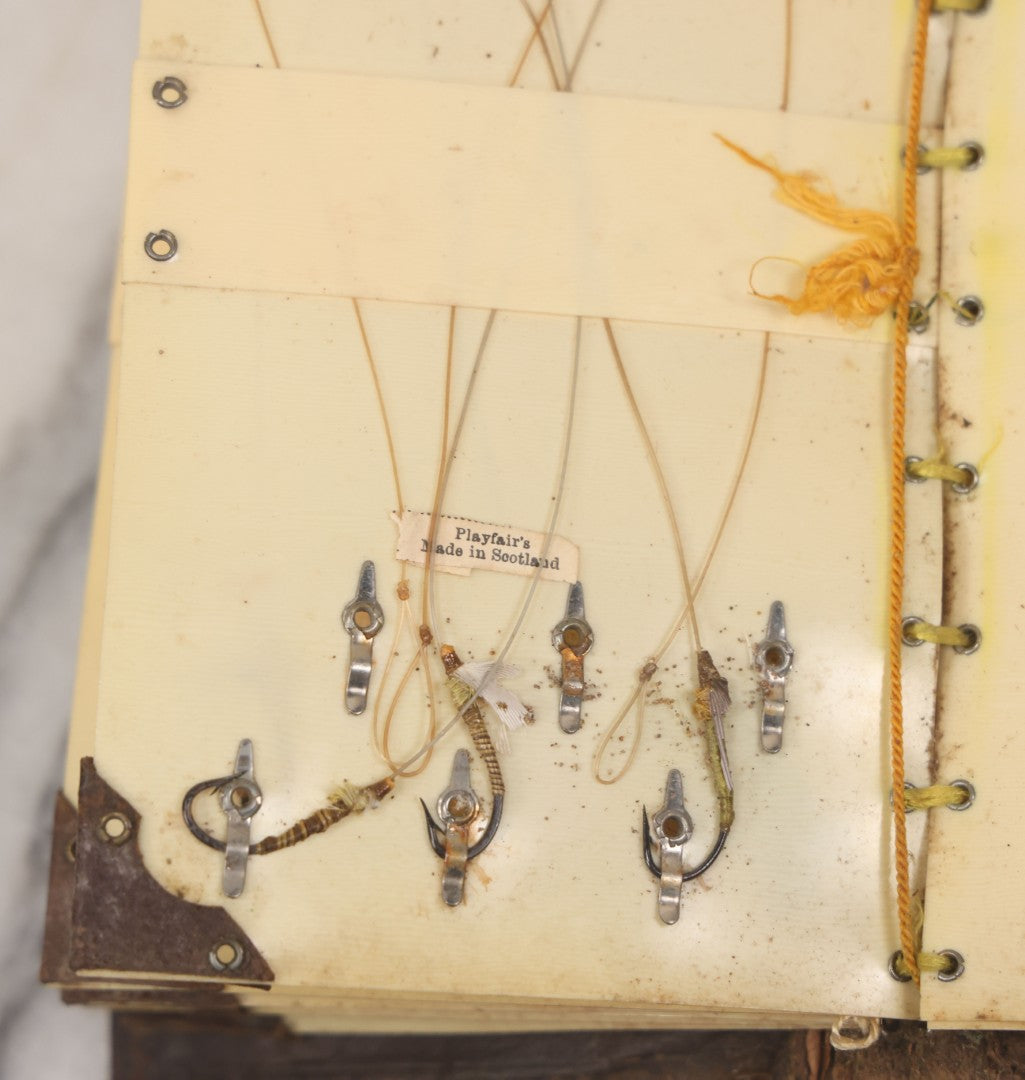 Lot 050 - Antique Leather Fly Fisherman's Wallet Book With Celluloid Pages, Many Fly Fishing Lures, Some Marked "Playfair's, Made In Scotland," Note Flies Have Varying Degrees Of Ware, Losses, As Found