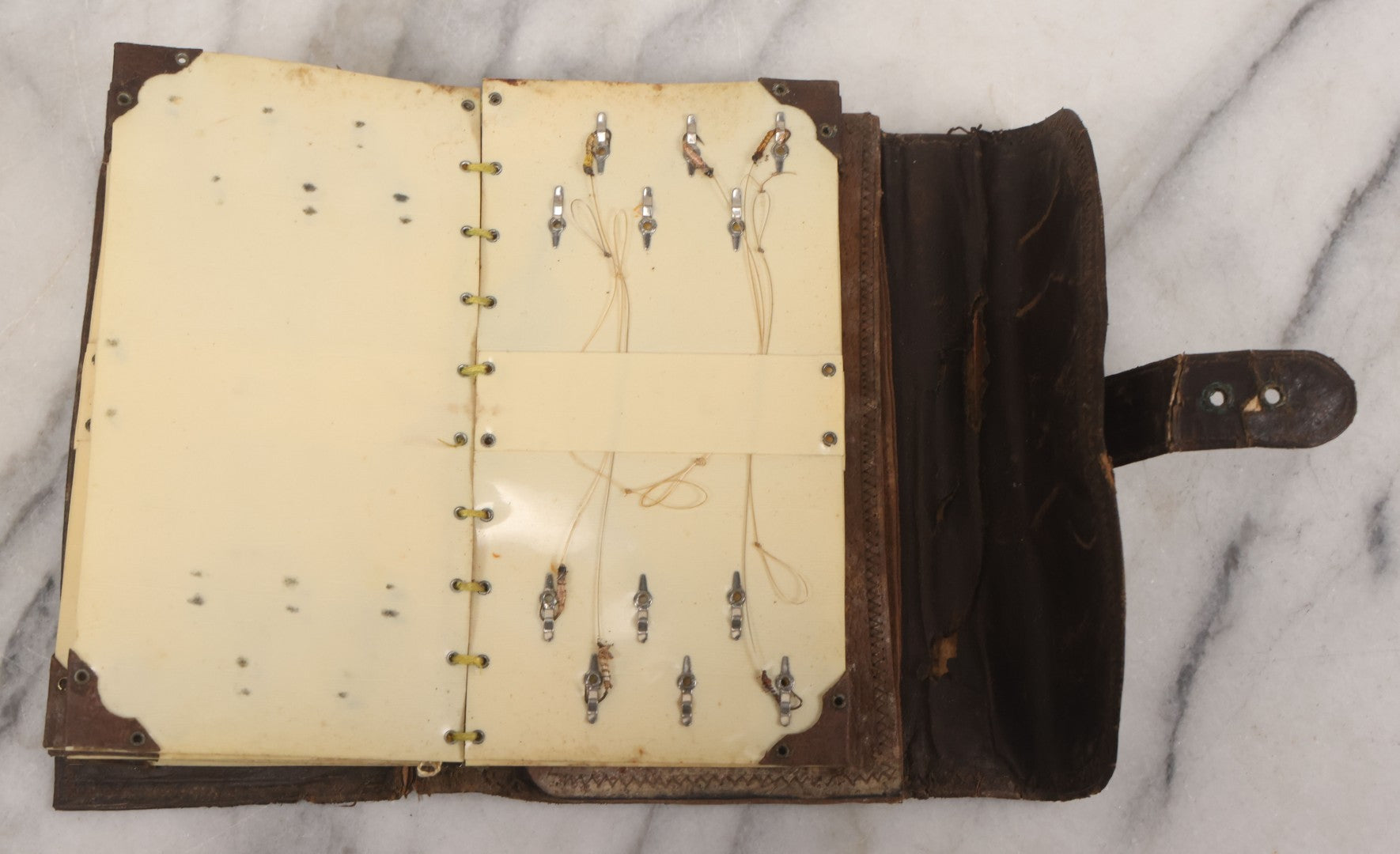 Lot 050 - Antique Leather Fly Fisherman's Wallet Book With Celluloid Pages, Many Fly Fishing Lures, Some Marked "Playfair's, Made In Scotland," Note Flies Have Varying Degrees Of Ware, Losses, As Found