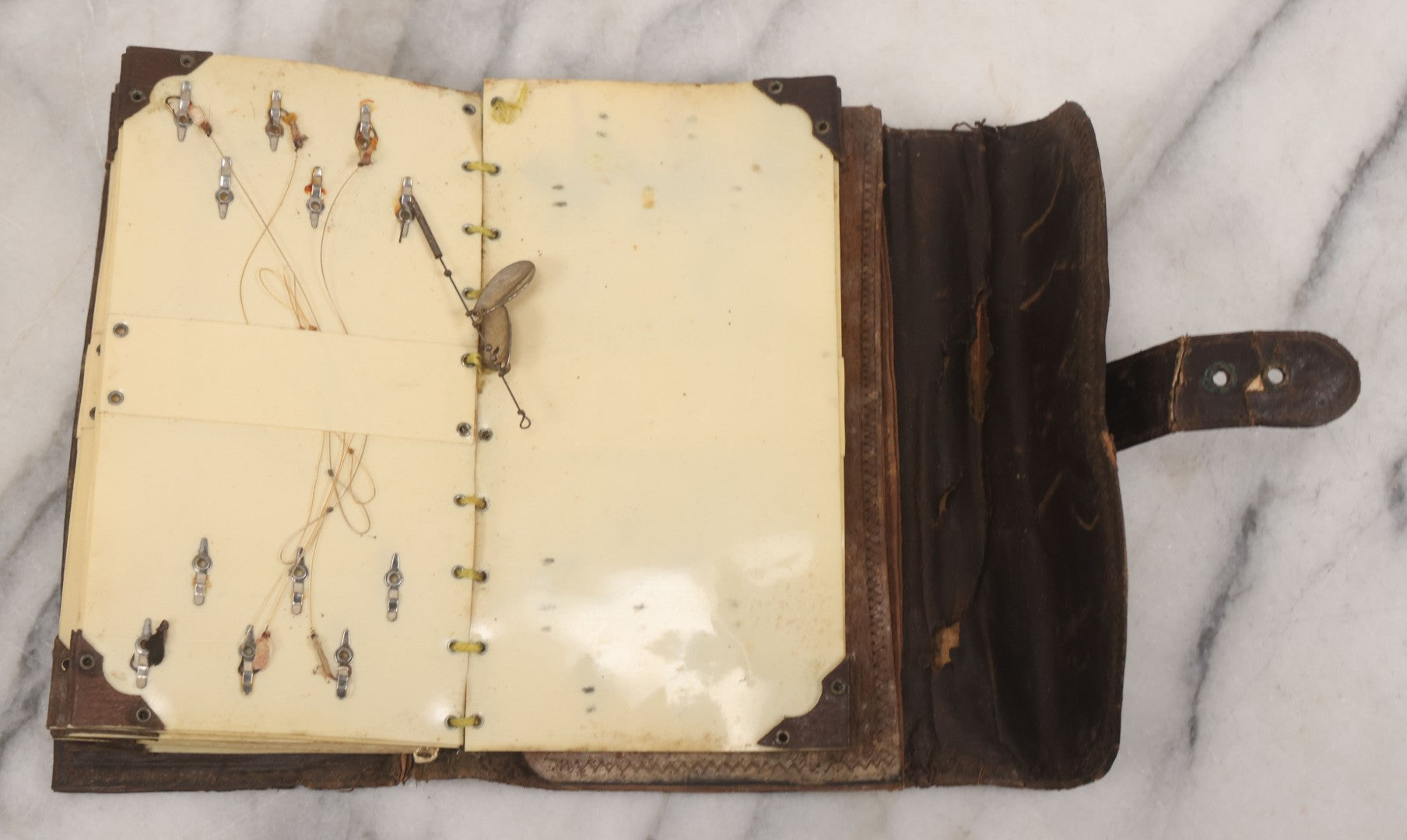 Lot 050 - Antique Leather Fly Fisherman's Wallet Book With Celluloid Pages, Many Fly Fishing Lures, Some Marked "Playfair's, Made In Scotland," Note Flies Have Varying Degrees Of Ware, Losses, As Found