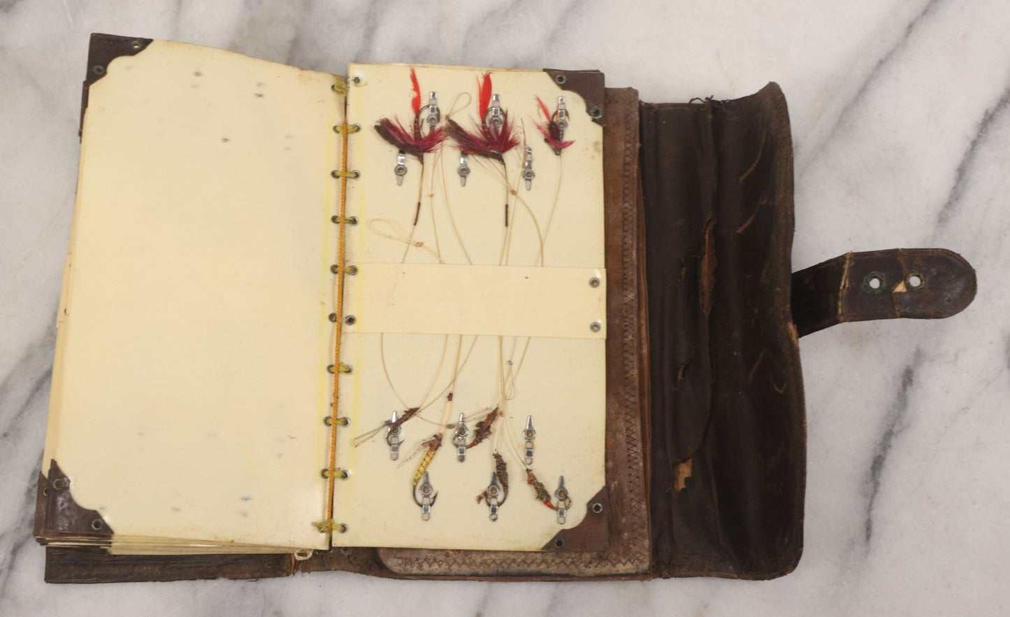 Lot 050 - Antique Leather Fly Fisherman's Wallet Book With Celluloid Pages, Many Fly Fishing Lures, Some Marked "Playfair's, Made In Scotland," Note Flies Have Varying Degrees Of Ware, Losses, As Found