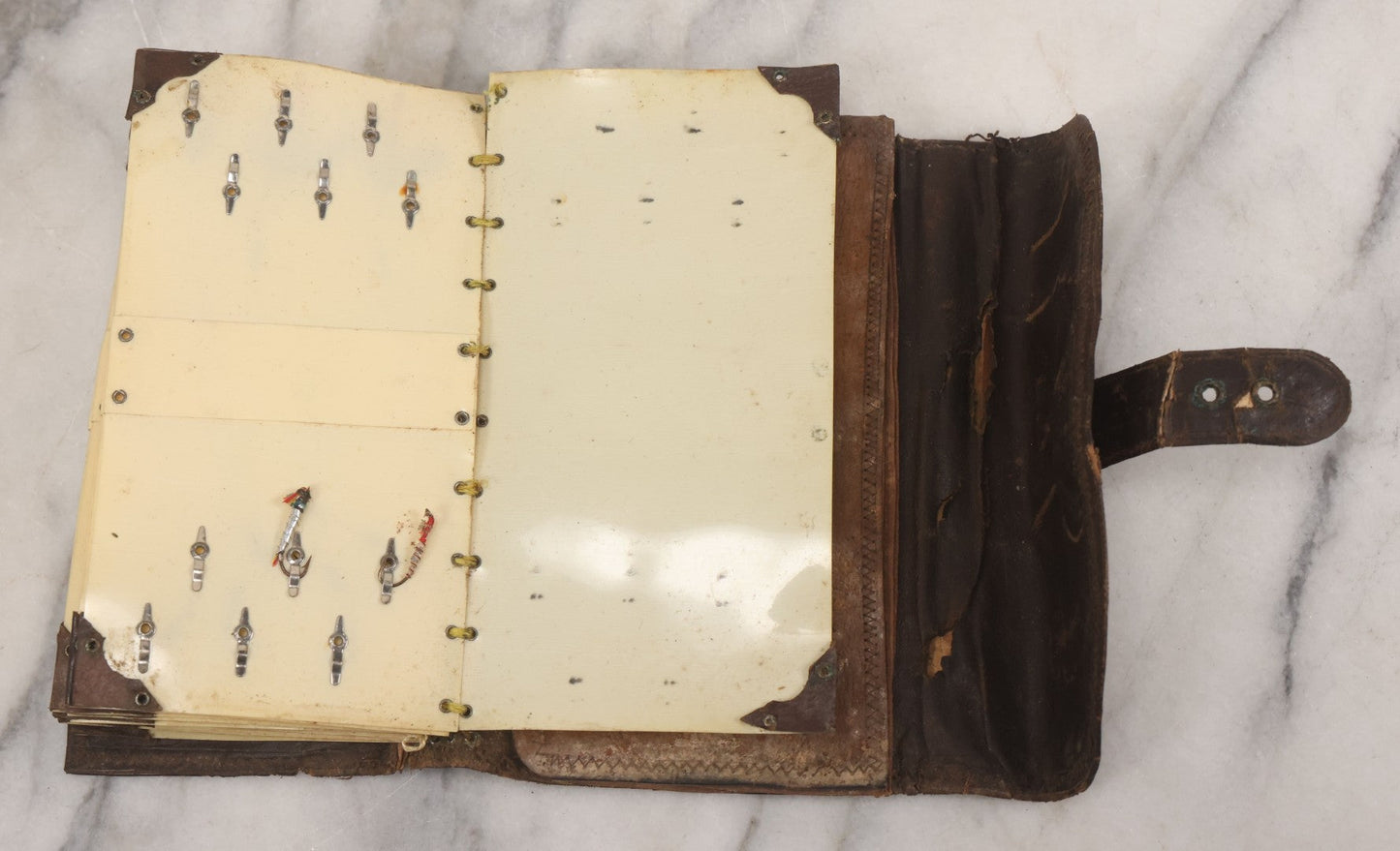Lot 050 - Antique Leather Fly Fisherman's Wallet Book With Celluloid Pages, Many Fly Fishing Lures, Some Marked "Playfair's, Made In Scotland," Note Flies Have Varying Degrees Of Ware, Losses, As Found