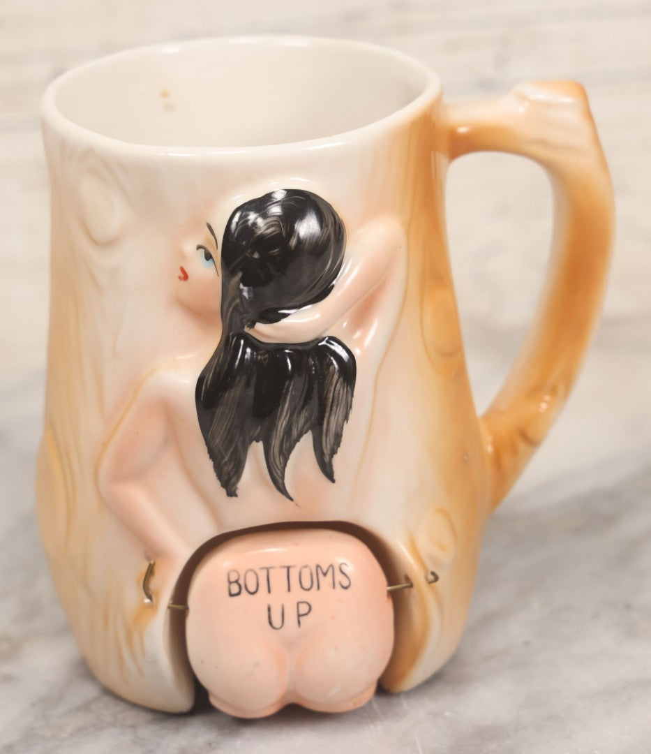 Lot 052 - Vintage Novelty Ceramic Gag Mug, "Bottoms Up" With Hinged Booty, Black Haired Woman, Made In Japan, 4-1/4" Height