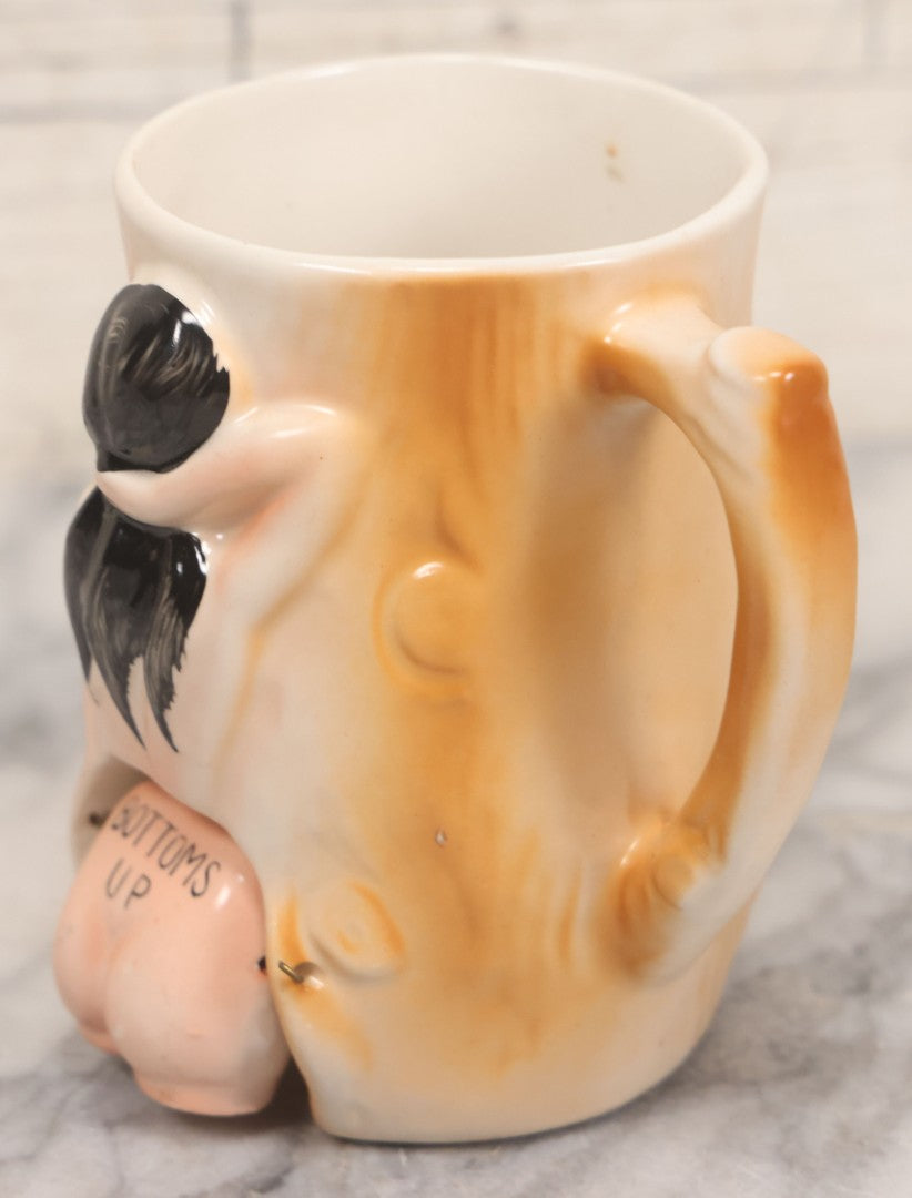 Lot 052 - Vintage Novelty Ceramic Gag Mug, "Bottoms Up" With Hinged Booty, Black Haired Woman, Made In Japan, 4-1/4" Height
