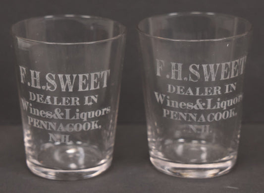 Lot 056 - Pair Of Vintage Glass Shot Glasses Advertising F.H. Sweet, Dealer In Wines & Liquors, Pennacook, New Hampshire