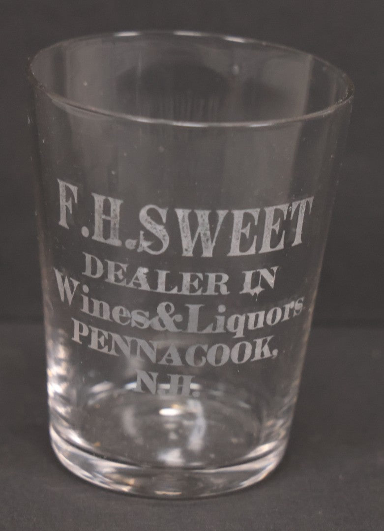 Lot 056 - Pair Of Vintage Glass Shot Glasses Advertising F.H. Sweet, Dealer In Wines & Liquors, Pennacook, New Hampshire