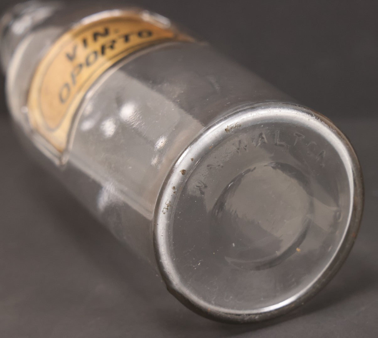 Lot 057 - Grouping Of Three Antique Glass Apothecary Bottles With Reverse Painted Glass Labels Including Syrup Of Ipecac (Syr. Ipecac.), Blackberry Wine (Vin. Rubi Vill.), And Port Wine (Vin. Oporto)