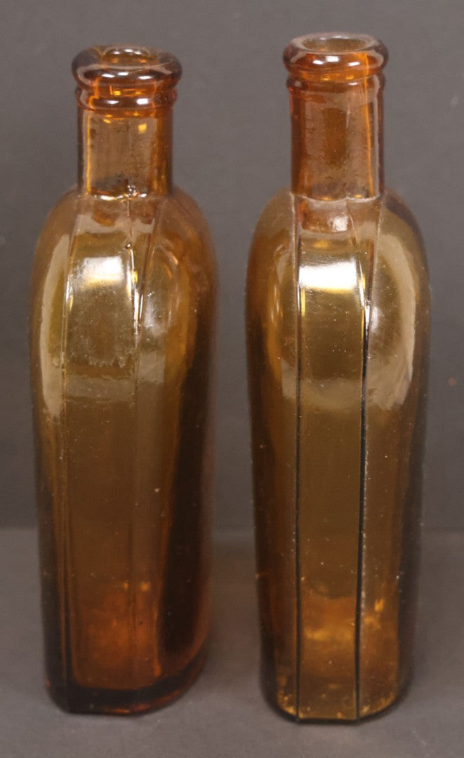 Lot 059 - Pair Of Antique Amber Glass Flask Bottles With Textured Glass