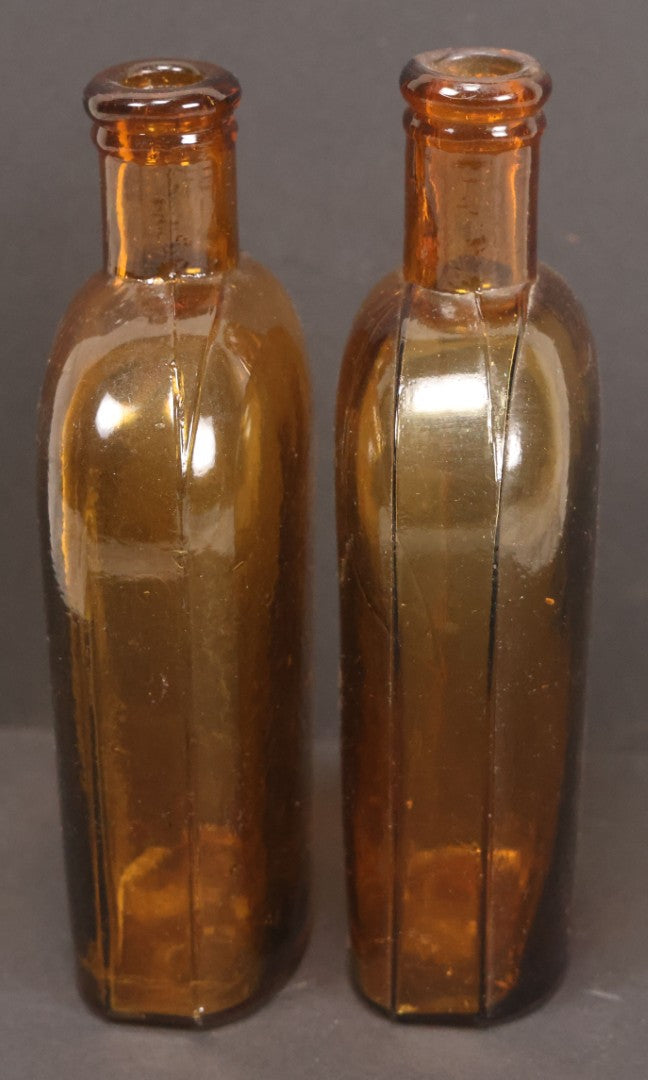 Lot 059 - Pair Of Antique Amber Glass Flask Bottles With Textured Glass