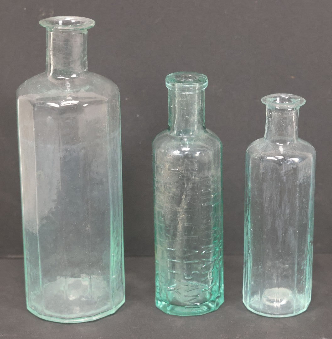 Lot 060 - Grouping Of Three Antique Apothecary Bottles Including Two Early Hand Blown Bottles With Pontil Marks, And Wilson's Pulmonary Cherry Balsam, Note Chips