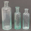 Lot 060 - Grouping Of Three Antique Apothecary Bottles Including Two Early Hand Blown Bottles With Pontil Marks, And Wilson's Pulmonary Cherry Balsam, Note Chips