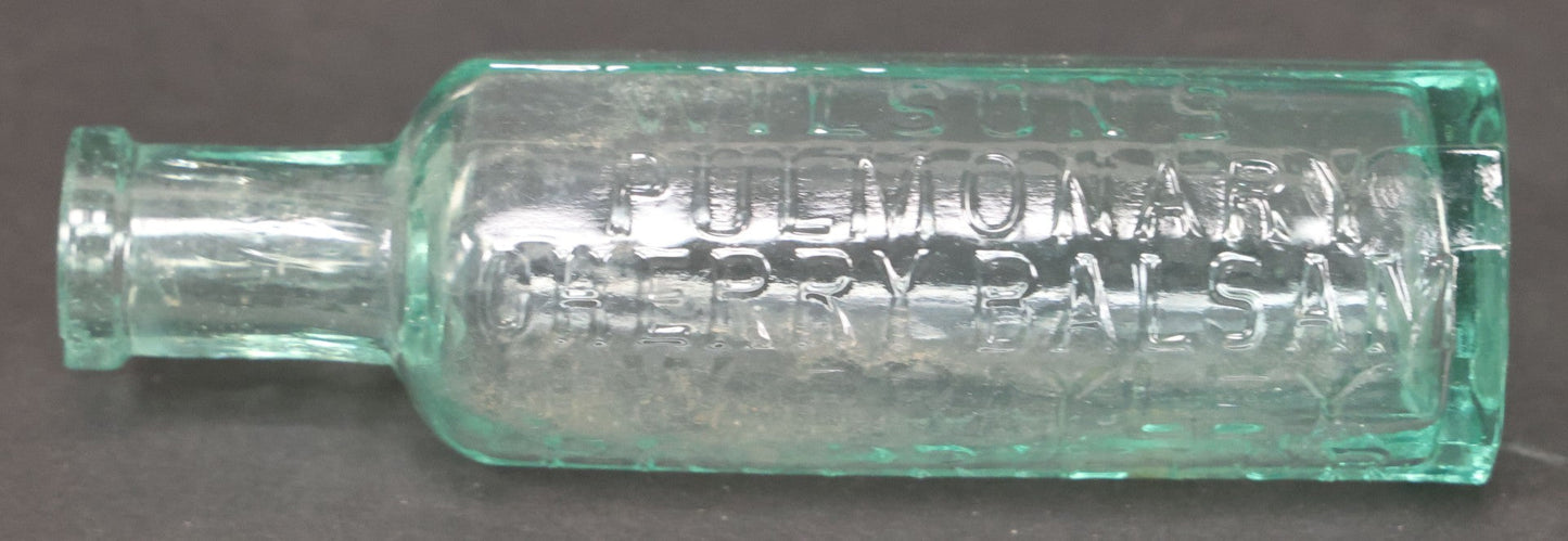 Lot 060 - Grouping Of Three Antique Apothecary Bottles Including Two Early Hand Blown Bottles With Pontil Marks, And Wilson's Pulmonary Cherry Balsam, Note Chips