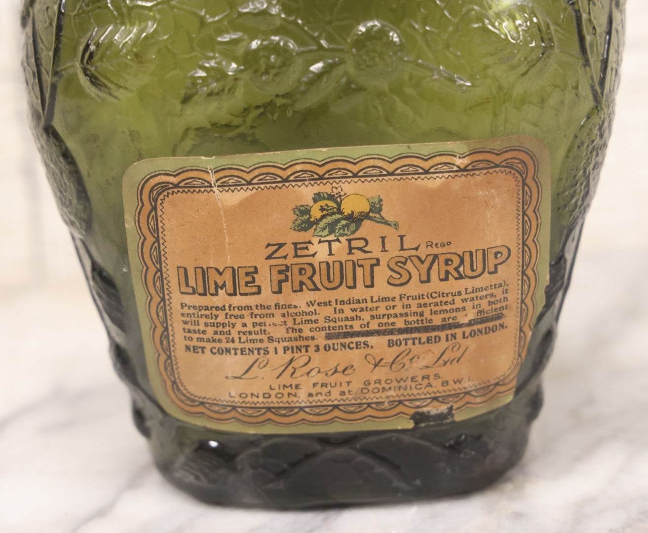 Lot 062 - Vintage Zetril Lime Fruit Syrup Green Glass Bottle With Original Paper Label, L. Rose & Co., Ltd., Lime And Fruit Growers, London And At Dominica B.W.I. (British West Indies), Bottled In London, 9-1/2" Height