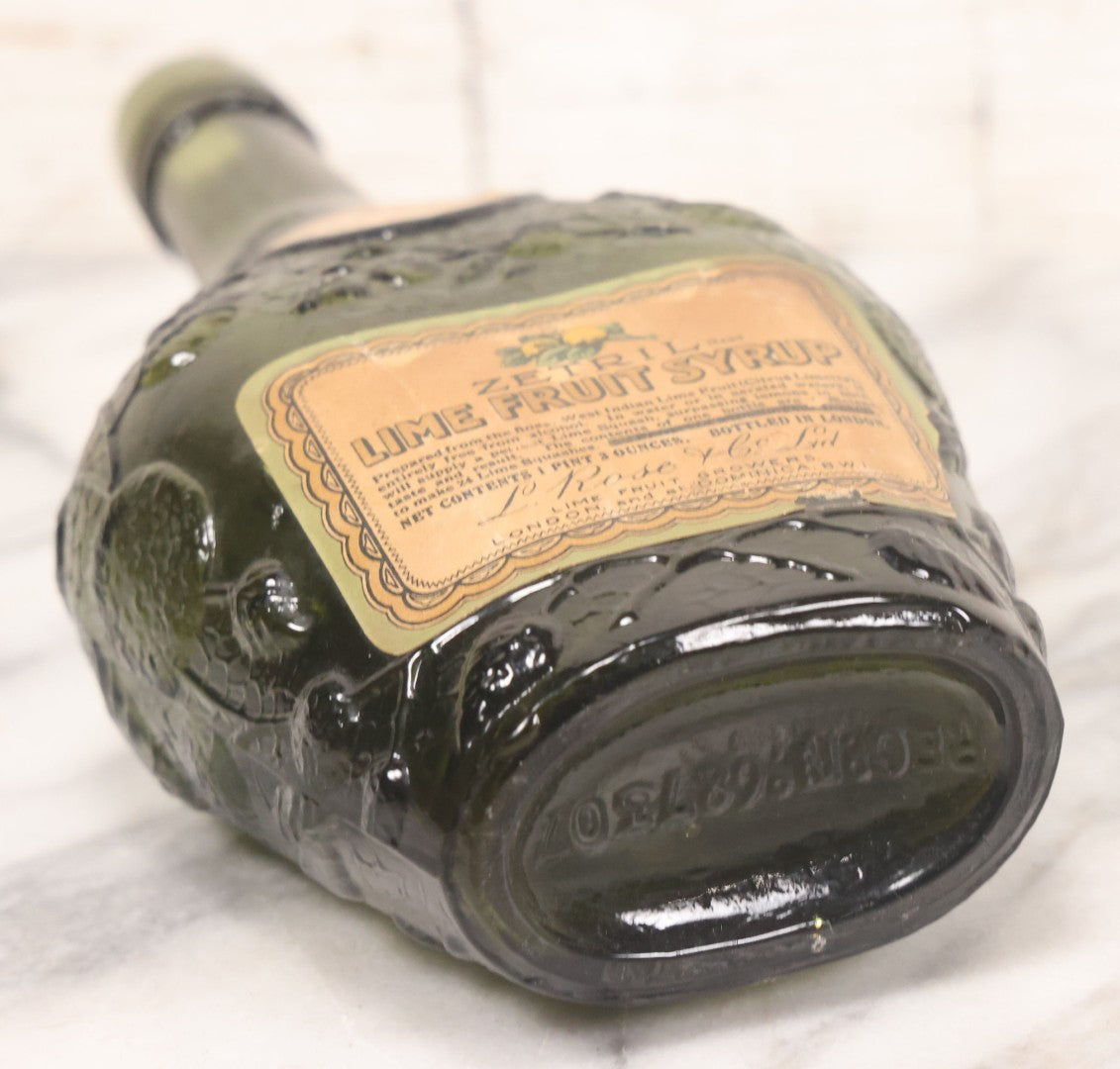 Lot 062 - Vintage Zetril Lime Fruit Syrup Green Glass Bottle With Original Paper Label, L. Rose & Co., Ltd., Lime And Fruit Growers, London And At Dominica B.W.I. (British West Indies), Bottled In London, 9-1/2" Height