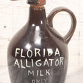 Lot 063 - Vintage Novelty Ceramic Florida Alligator Milk Decanter With Figural Alligator Spout Stopper, "Only 20 Minutes Old," 7-3/4" Height