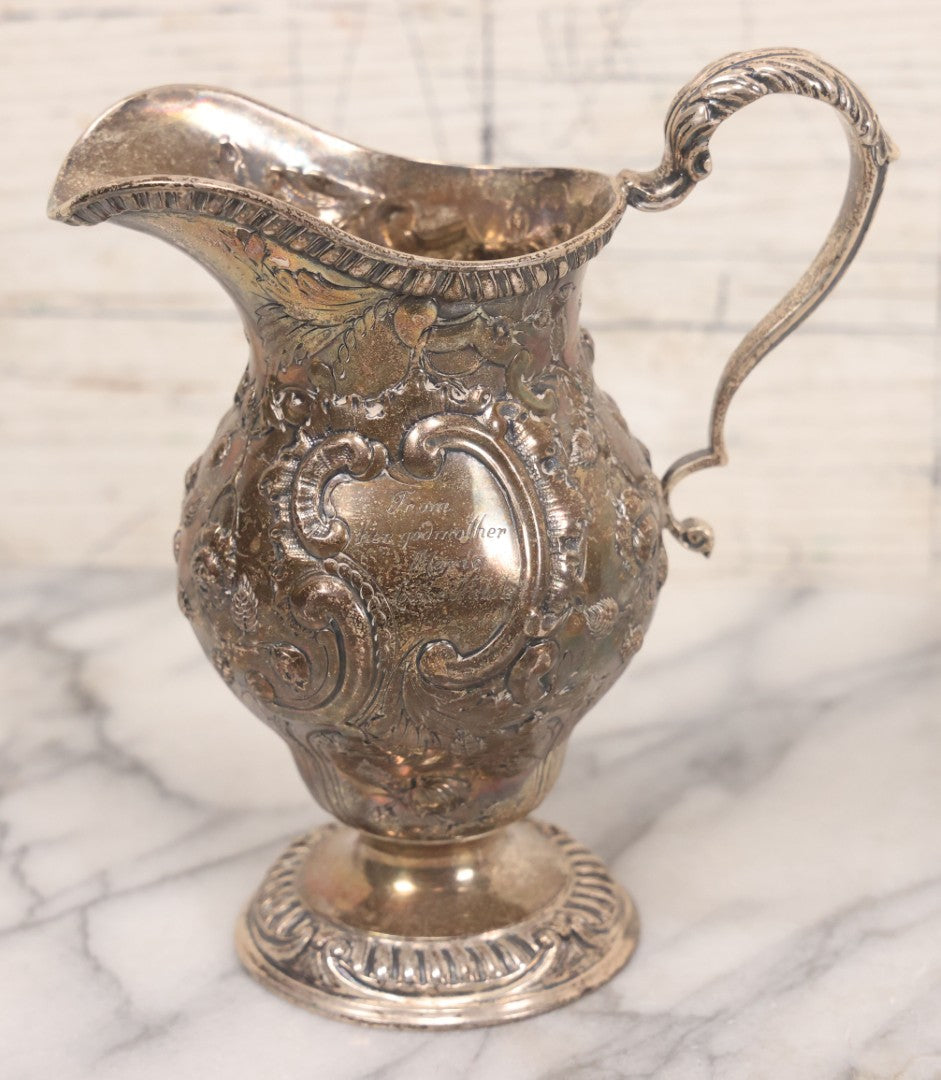 Lot 068 - Antique Silverplate Gift Ewer With Floral, Scroll And Curtain Motifs, Engraved "Lorraine Craven Manny 27th July 1919" Front, "From Her Godmother Marie Louise Nichols" On Verso, Hallmarked, Mfd. By Crichton Bros., London & New York, 5-3/4" H