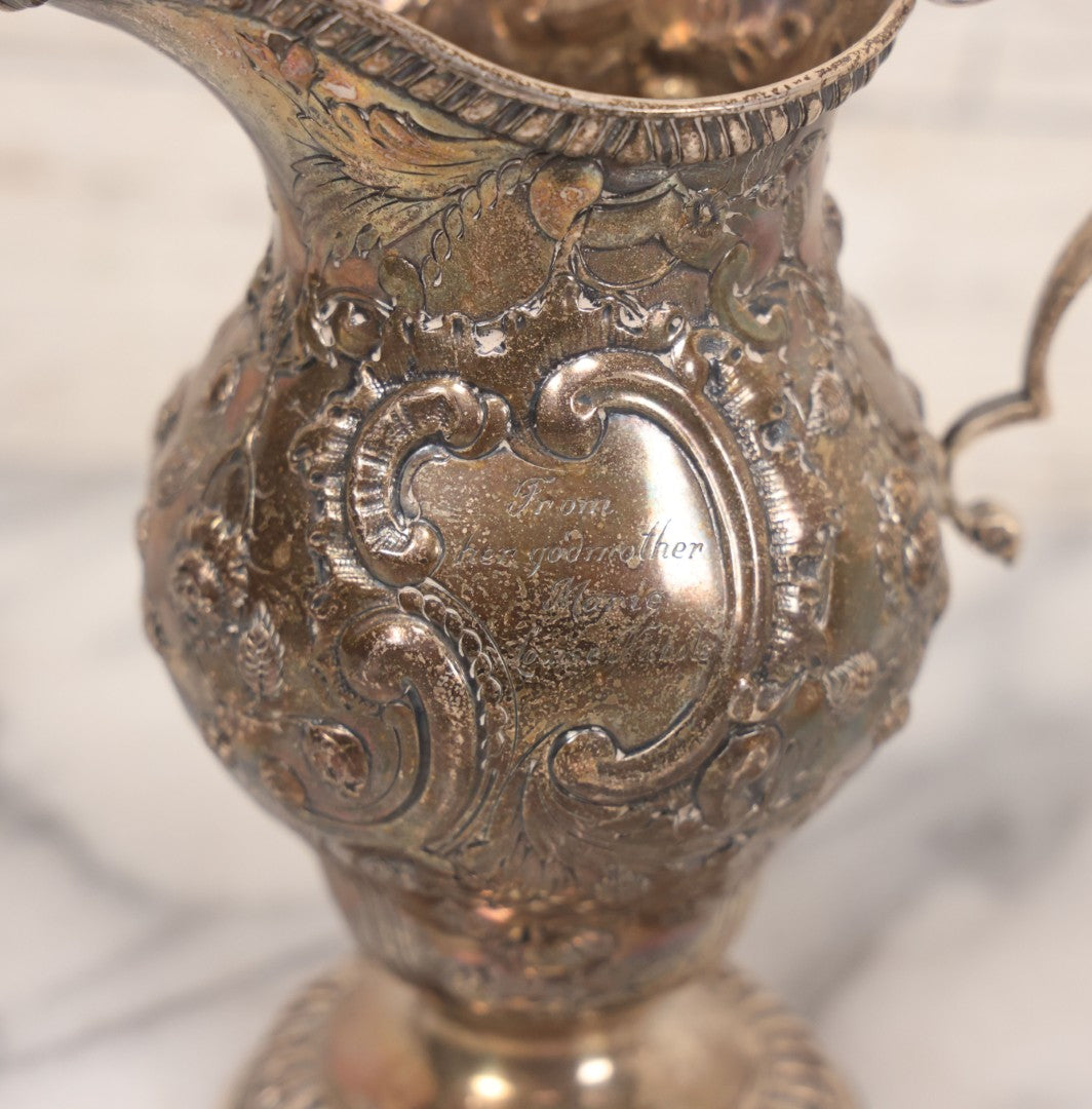 Lot 068 - Antique Silverplate Gift Ewer With Floral, Scroll And Curtain Motifs, Engraved "Lorraine Craven Manny 27th July 1919" Front, "From Her Godmother Marie Louise Nichols" On Verso, Hallmarked, Mfd. By Crichton Bros., London & New York, 5-3/4" H