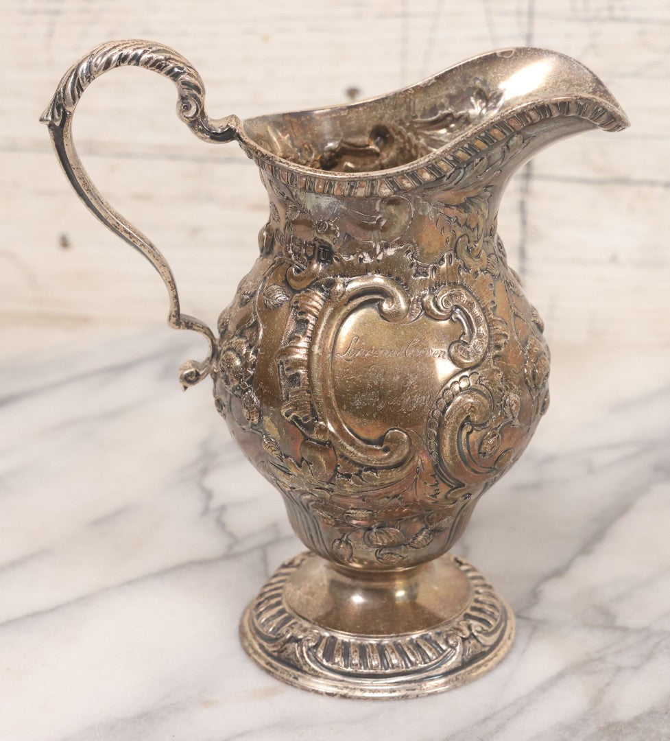 Lot 068 - Antique Silverplate Gift Ewer With Floral, Scroll And Curtain Motifs, Engraved "Lorraine Craven Manny 27th July 1919" Front, "From Her Godmother Marie Louise Nichols" On Verso, Hallmarked, Mfd. By Crichton Bros., London & New York, 5-3/4" H