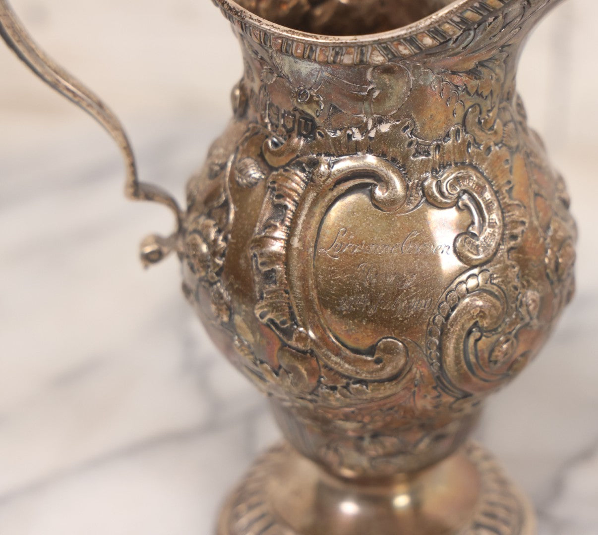 Lot 068 - Antique Silverplate Gift Ewer With Floral, Scroll And Curtain Motifs, Engraved "Lorraine Craven Manny 27th July 1919" Front, "From Her Godmother Marie Louise Nichols" On Verso, Hallmarked, Mfd. By Crichton Bros., London & New York, 5-3/4" H