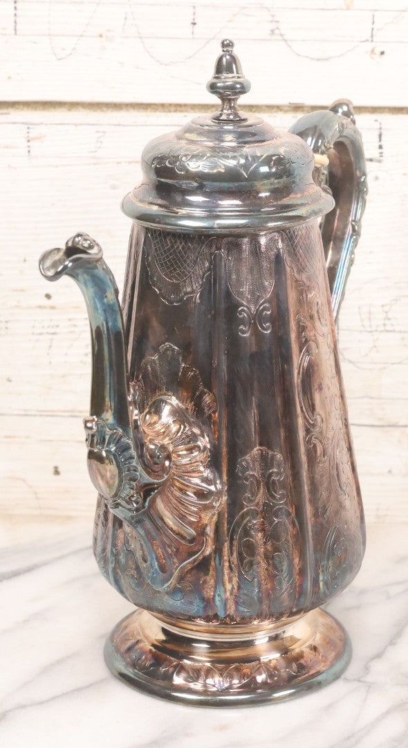 Lot 069 - Antique Embellished And Etched Silverplate Teapot With Hinged Lid And Handle With Bone Fittings, With Floral, Scroll And Pineapple Motifs, Engraved L.C. And W. R. M. 1916, 10-1/2" Height