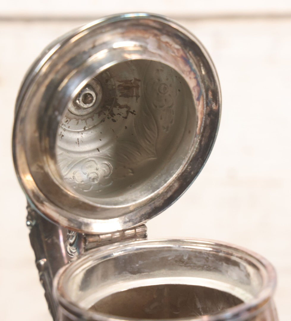 Lot 069 - Antique Embellished And Etched Silverplate Teapot With Hinged Lid And Handle With Bone Fittings, With Floral, Scroll And Pineapple Motifs, Engraved L.C. And W. R. M. 1916, 10-1/2" Height