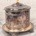 Lot 070 - Antique Etched Silverplate Single Piece Lidded Jar With Hinged Lid And Bone Handle On Slotted Tray With Feet, With Flower And Leaf Wreaths And Rope Twist Motifs, Marked J. E. & S. Ltd., Made In England, 7-1/2" Height
