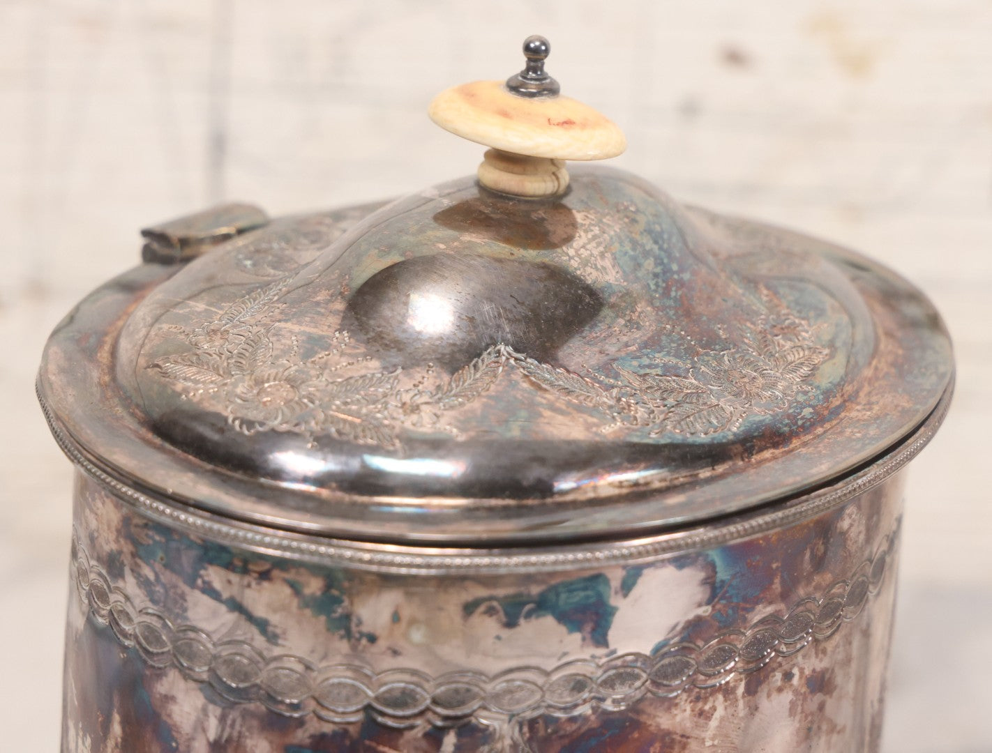 Lot 070 - Antique Etched Silverplate Single Piece Lidded Jar With Hinged Lid And Bone Handle On Slotted Tray With Feet, With Flower And Leaf Wreaths And Rope Twist Motifs, Marked J. E. & S. Ltd., Made In England, 7-1/2" Height