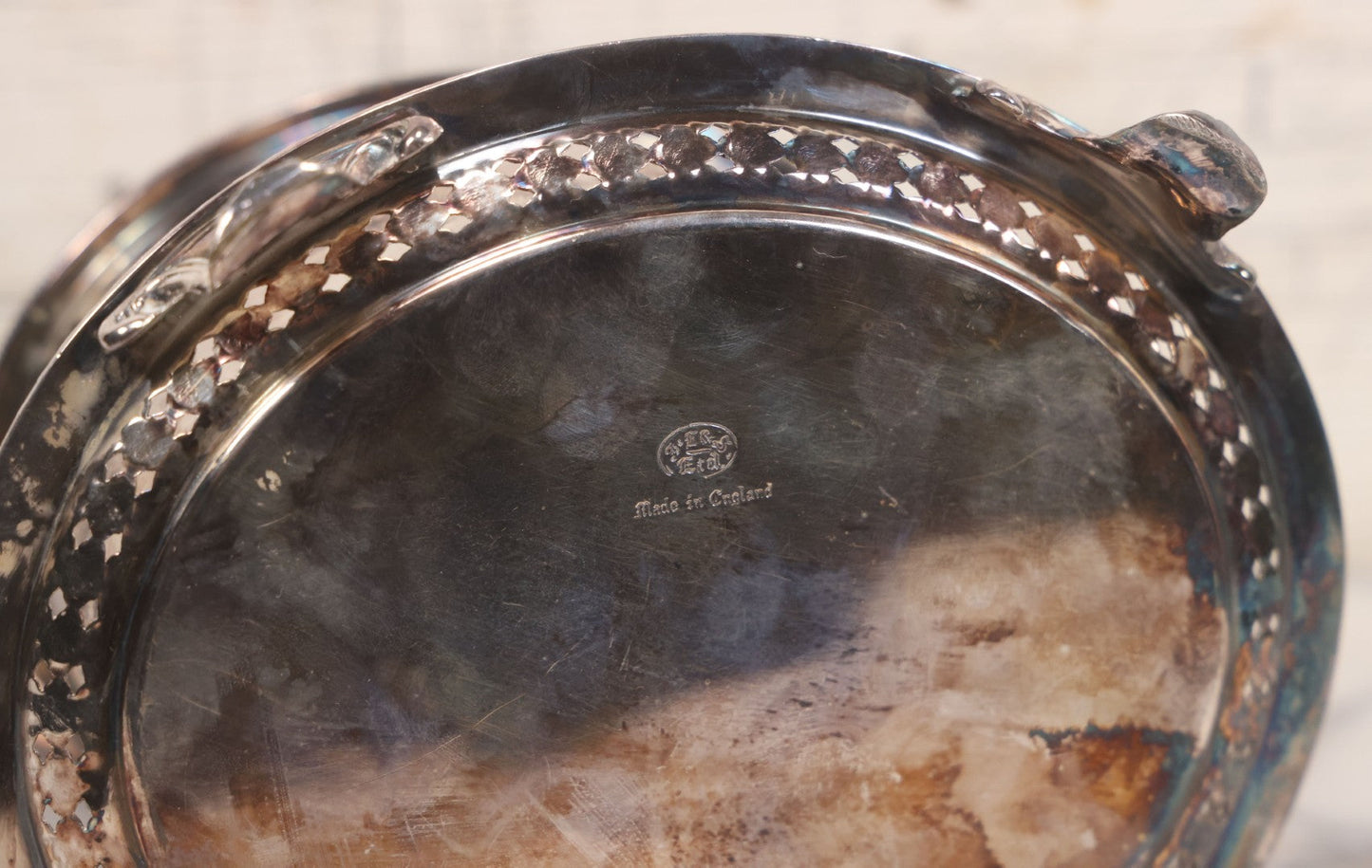 Lot 070 - Antique Etched Silverplate Single Piece Lidded Jar With Hinged Lid And Bone Handle On Slotted Tray With Feet, With Flower And Leaf Wreaths And Rope Twist Motifs, Marked J. E. & S. Ltd., Made In England, 7-1/2" Height