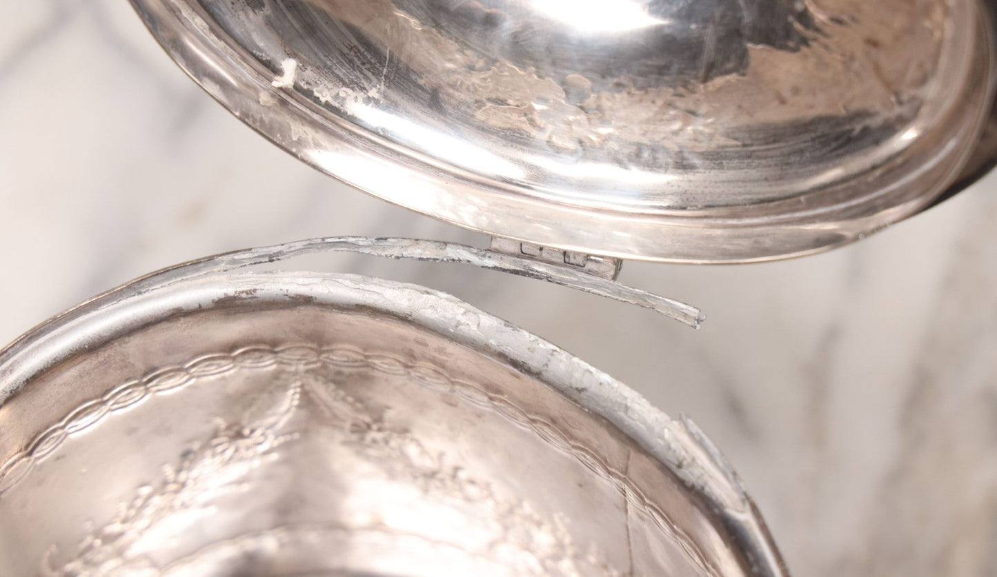 Lot 070 - Antique Etched Silverplate Single Piece Lidded Jar With Hinged Lid And Bone Handle On Slotted Tray With Feet, With Flower And Leaf Wreaths And Rope Twist Motifs, Marked J. E. & S. Ltd., Made In England, 7-1/2" Height