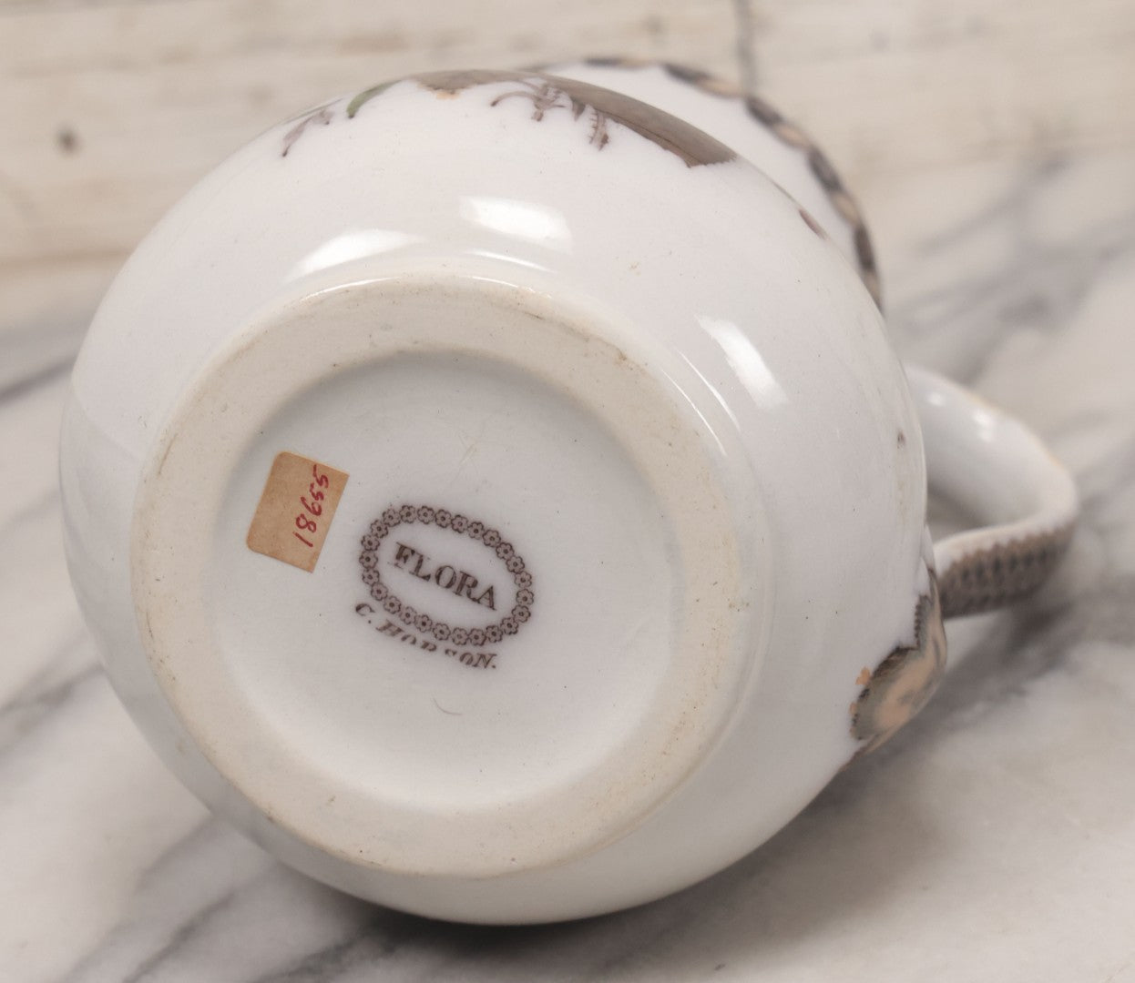 Lot 071 - Antique Painted Transferware Earthenware Pitcher With Floral Design, Marked "Flora" On Bottom, Manufactured By Charles Hobson, 7-1/4" Height