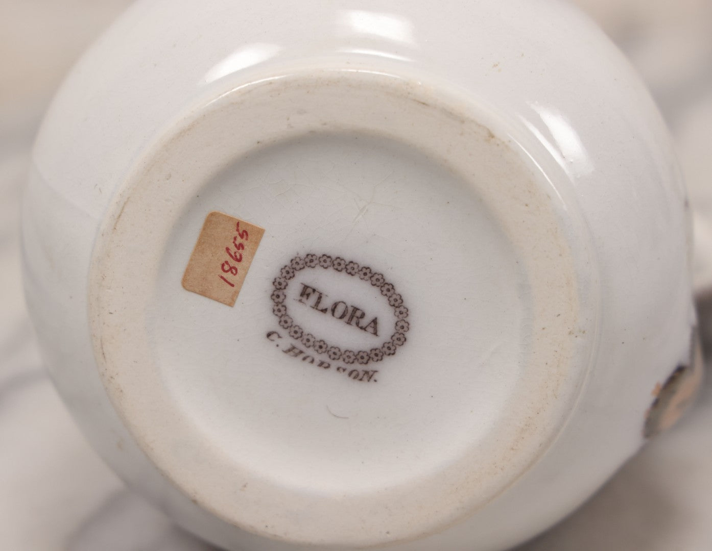 Lot 071 - Antique Painted Transferware Earthenware Pitcher With Floral Design, Marked "Flora" On Bottom, Manufactured By Charles Hobson, 7-1/4" Height