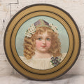 Lot 079 - Antique Chromolithograph Print Of Little Blonde Girl With Flowers In Her Hair, In Circular Reverse Painted Glass Frame, 7-7/8" Diameter