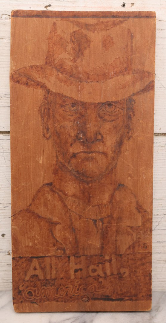Lot 082 - Vintage Folk Art Western Americana Pyrography Wood Burned Panel Depicting A Stern Cowboy, Captioned "All Hail, America," Artist Initialed J.S., 7" x 14-1/2"