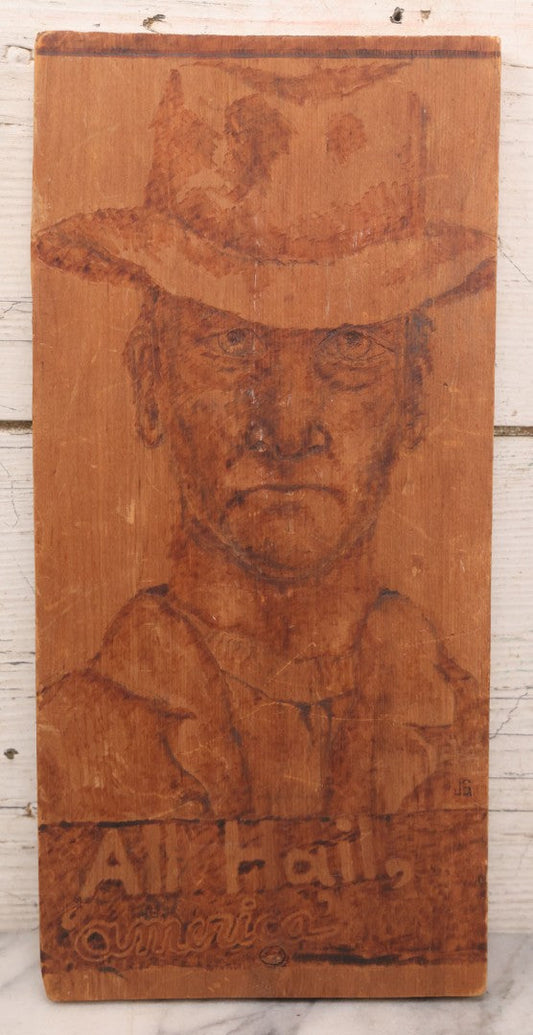 Lot 082 - Vintage Folk Art Western Americana Pyrography Wood Burned Panel Depicting A Stern Cowboy, Captioned "All Hail, America," Artist Initialed J.S., 7" x 14-1/2"