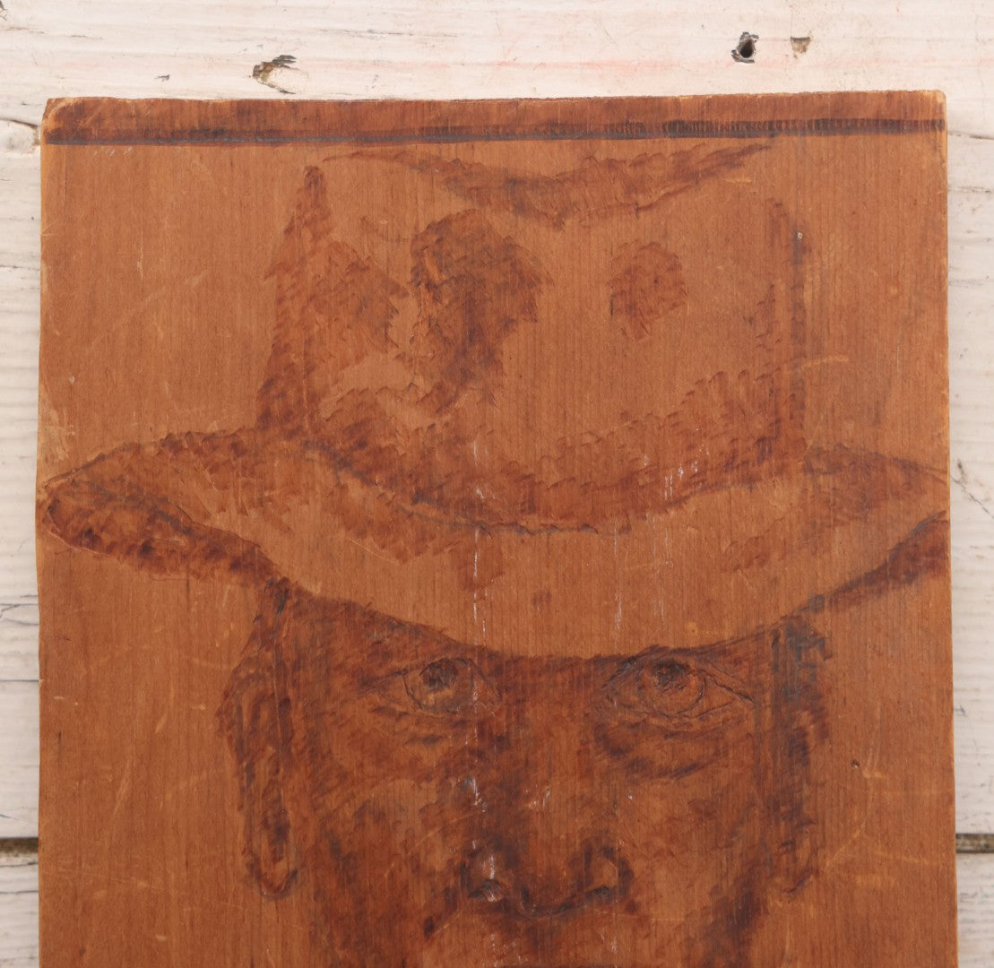 Lot 082 - Vintage Folk Art Western Americana Pyrography Wood Burned Panel Depicting A Stern Cowboy, Captioned "All Hail, America," Artist Initialed J.S., 7" x 14-1/2"
