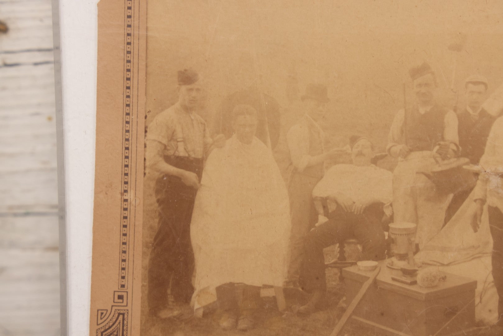 Lot 083 - Antique Boarded Photograph Of Soldier's Shaving Tent With Men Posing With Rifles, Barber, Implements And Tools, Photo By J.W. Culverhouse, " 7A The Parade, Trowbridge" Wiltshire, England, Note Photo Damaged, Losses