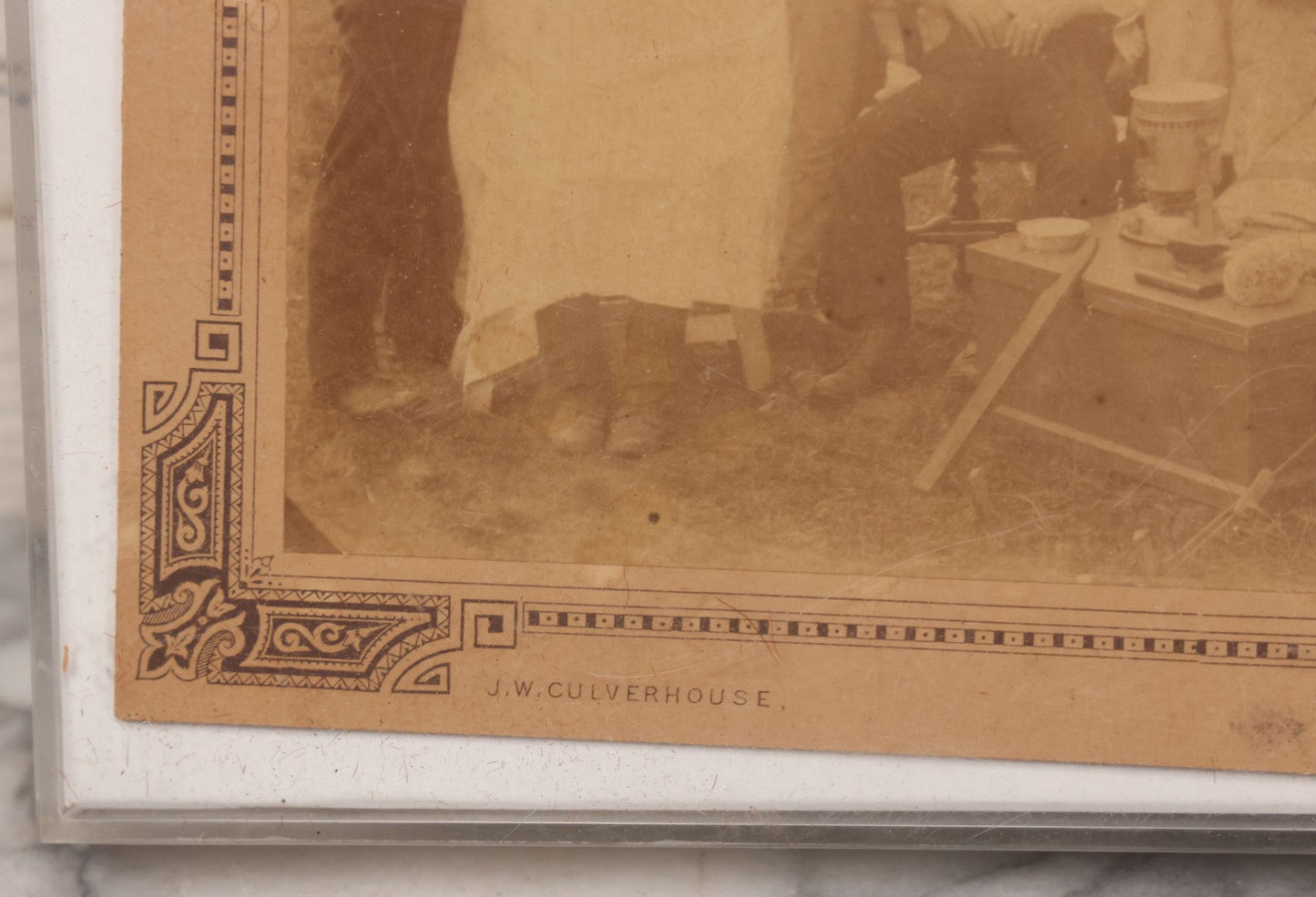 Lot 083 - Antique Boarded Photograph Of Soldier's Shaving Tent With Men Posing With Rifles, Barber, Implements And Tools, Photo By J.W. Culverhouse, " 7A The Parade, Trowbridge" Wiltshire, England, Note Photo Damaged, Losses