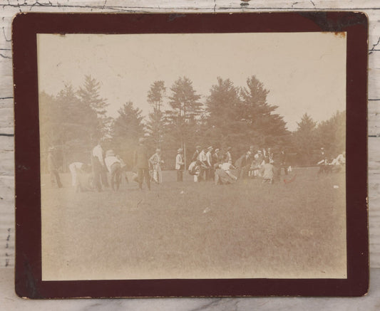 Lot 084 - Antique Boarded Photograph Of A Group Of Adults Engaged In A Tug-O-War Game In A Field