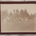 Lot 084 - Antique Boarded Photograph Of A Group Of Adults Engaged In A Tug-O-War Game In A Field