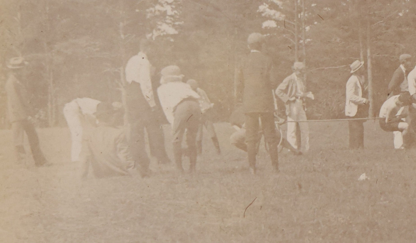 Lot 084 - Antique Boarded Photograph Of A Group Of Adults Engaged In A Tug-O-War Game In A Field