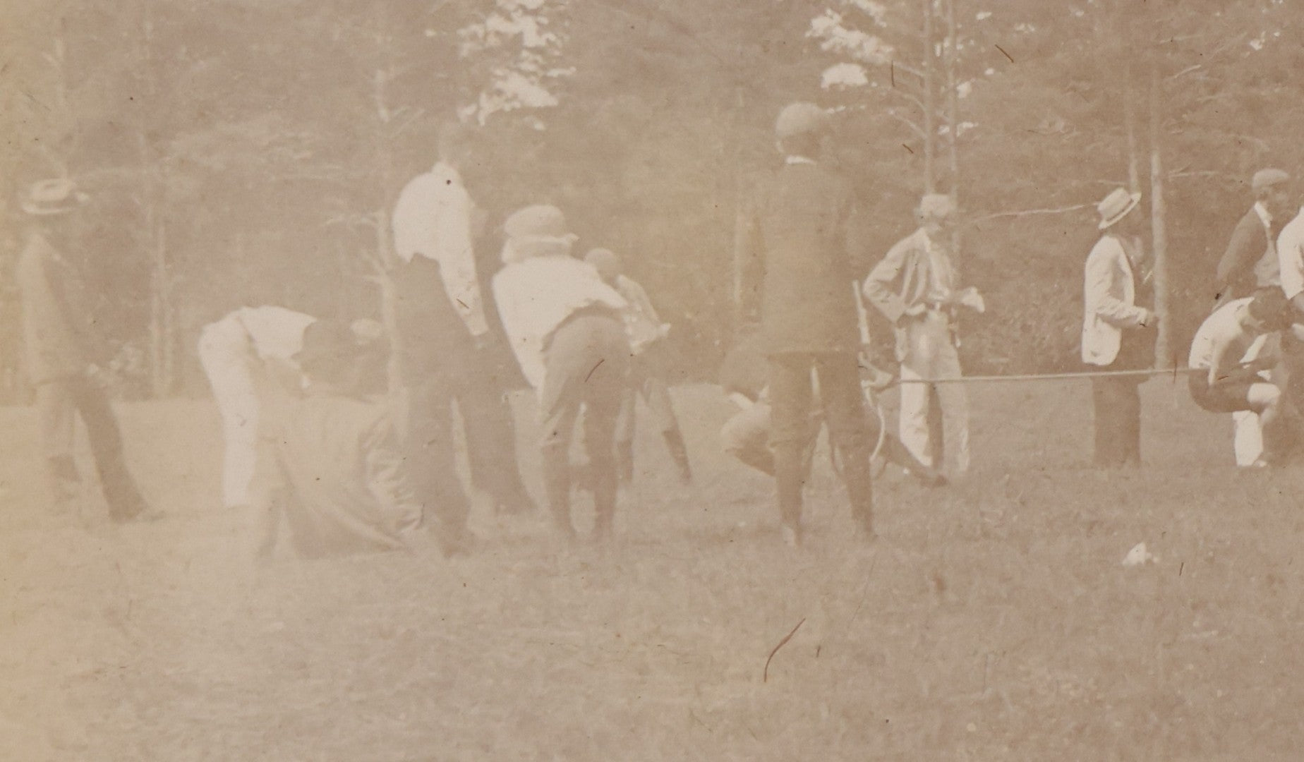Lot 084 - Antique Boarded Photograph Of A Group Of Adults Engaged In A Tug-O-War Game In A Field