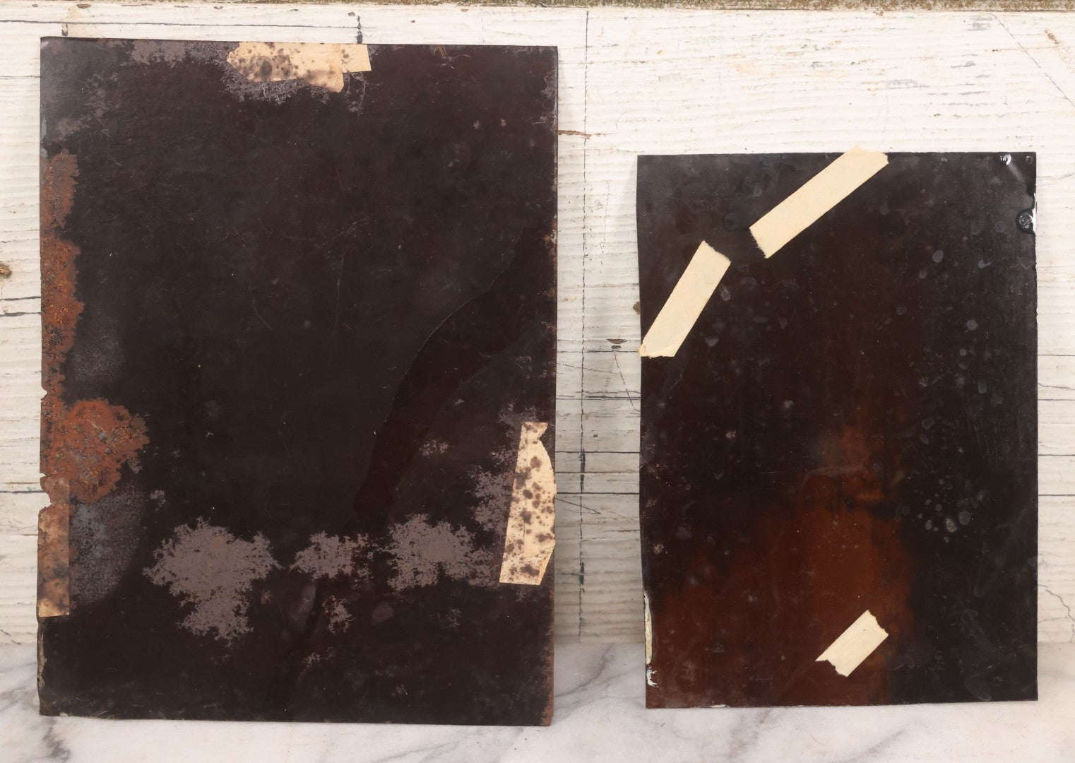 Lot 085 - Pair Of Antique Tintype Photographs Including Half Plate Tintype Of A Young Girl With Striped Socks And A Full Plate Tintype Of A Serious Looking Woman With Folded Hands