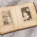 Lot 086 - Antique Family Photo Album With Mostly Trimmed Real Photo Postcards R.P.P.C., Snapshots, And Other Photos, With 26 Photos In All, Including Girl With Doll, Soldier, Woman With Dog, And Others, Most Identified