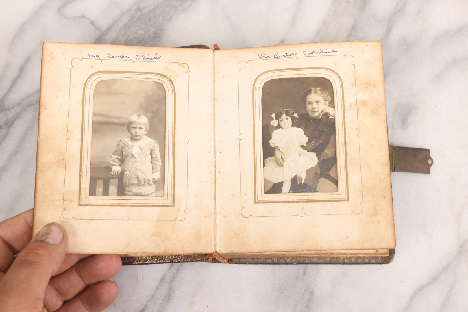 Lot 086 - Antique Family Photo Album With Mostly Trimmed Real Photo Postcards R.P.P.C., Snapshots, And Other Photos, With 26 Photos In All, Including Girl With Doll, Soldier, Woman With Dog, And Others, Most Identified