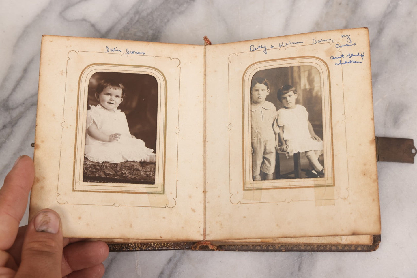 Lot 086 - Antique Family Photo Album With Mostly Trimmed Real Photo Postcards R.P.P.C., Snapshots, And Other Photos, With 26 Photos In All, Including Girl With Doll, Soldier, Woman With Dog, And Others, Most Identified