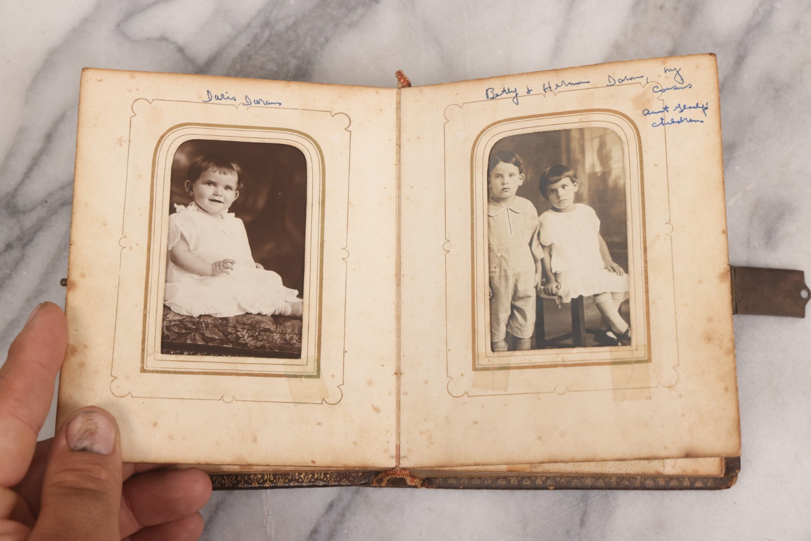 Lot 086 - Antique Family Photo Album With Mostly Trimmed Real Photo Postcards R.P.P.C., Snapshots, And Other Photos, With 26 Photos In All, Including Girl With Doll, Soldier, Woman With Dog, And Others, Most Identified